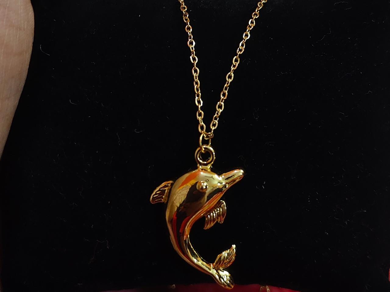 Dolphin charm necklace from Saj Kotha